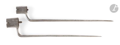 two forks are shown on a white surface with a white background