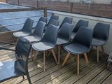 many chairs that are sitting on a wooden deck