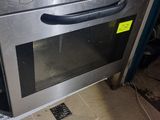 a silver oven with two burners on top of it in a kitchen