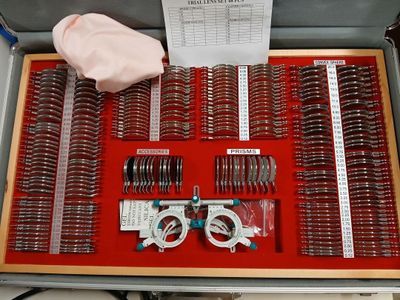 a box with a bunch of scissors and a pair of scissors