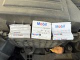 a picture of a car engine with some stickers on it