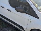 the white van is parked on the side of the road in the grass