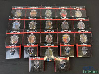 lot of 12 badges in plastic bags on a black table