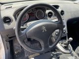 dashboard of a car with a steering wheel and dashboard gauges