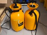 two yellow containers sitting next to each other on the floor
