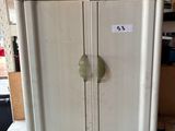 a refrigerator that is sitting on a table in a room