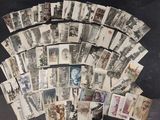 a lot of old postcards on the table