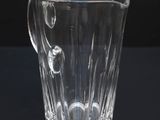 a glass cup that is sitting on a table