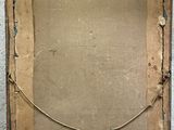 an old picture frame sitting on a cement floor next to a wall