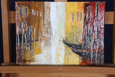 a painting that is on a easel in a room
