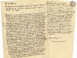 two old papers with writing on them sitting next to each other