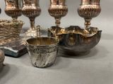 a lot of silver items that are on the table
