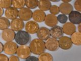 a lot of coins that are laying on a table