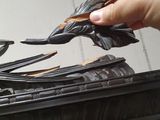 a hand that is holding a piece of metal