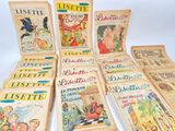 several children ' s books are lined up on a white surface