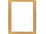 a gold picture frame against a white wall