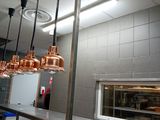 many lights hanging from the ceiling in the kitchen