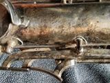 a close up of a silver instrument on a table