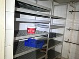 a room that has a bunch of shelves in it