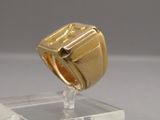 a gold ring with a roman numeral signet on it