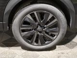 a close up of a tire on a car ' s rim