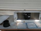 a microwave oven sitting on a table in a garage