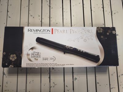 fer à boucler de marque REMINGTON - Photo 1