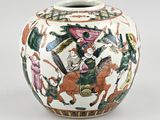 a white vase with a picture of a man riding a horse on it