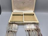 a box with silverware in it on a table