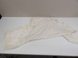 a white table with a white cloth on top of it