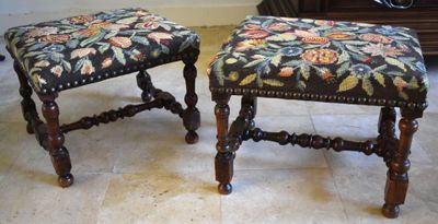 two stools that are sitting on a tile floor
