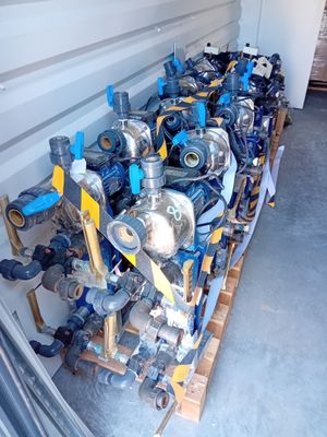 many different types of valves lined up on a pallet