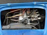 a close up of a small engine in the trunk of a car