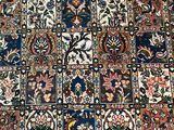 an image of a patchwork rug with many different colors and patterns