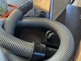 a hose that is sitting on a table next to a box