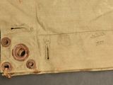 an image of a piece of cloth with holes in it