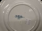 a white plate with a blue and white design on it