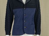 an image of a mannequin wearing a blue and black jacket