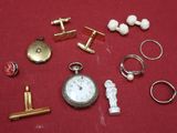 many different types of jewelry on a red surface