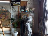 a statue of a dog in the corner of a room