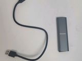 a usb cable connected to an external device on a table