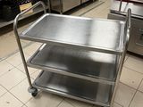 a metal cart in the middle of a kitchen