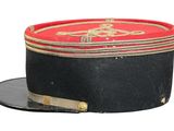 a black hat with a red and gold design on it