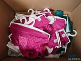 a cardboard box filled with underwear and a pair of scissors