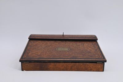 an old wooden box with a lid on a white background