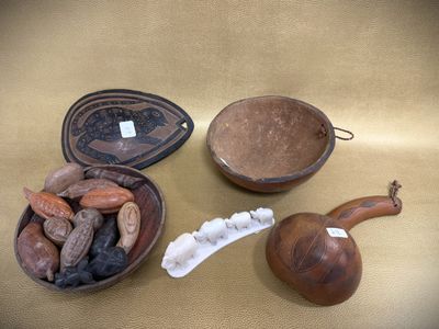 a bowl of nuts and a bowl of chocolate beans on a table