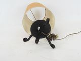 a lamp that is sitting on a table with a cord
