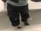 a reflection of a person in a mirror of a person on a skateboard
