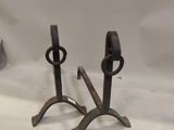 pair of antique iron candlesticks on a white background