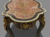 a small table with a flower design on top of it